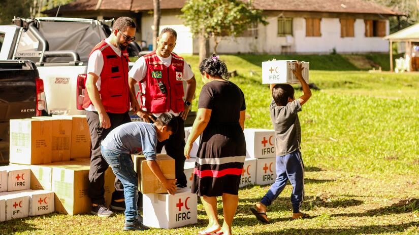 Brazilian Red Cross volunteers deliver boxes of relief items to the indigenous community of Goj Kusug in Rio Grande do Sul, Brazil, a community that indirectly affected by the floods.  